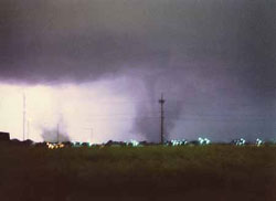 This is the only known photo printed of the tornadoes. The sky was illuminated by lightning, allowing Rod Gartner to get the picture looking north from North Johnson Drive. The apartments at far left at near Faidley and Webb roads. The tornado in the center, and a sister twister at left, were ripping through north-central Grand Island.